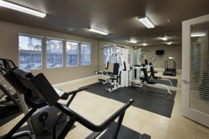 fitness center with strength training and cardio equipment