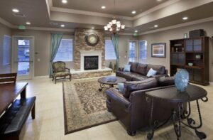large community room with lounge area and fireplace